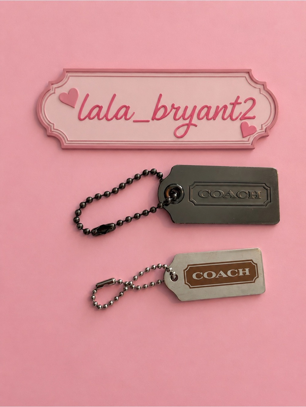 Coach gunmetal and metal hang tags